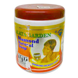 Diamond Garden Natural Alata Soap 600g in a clear package, showing brown traditional African black soap with a green and yellow product label featuring natural elements.